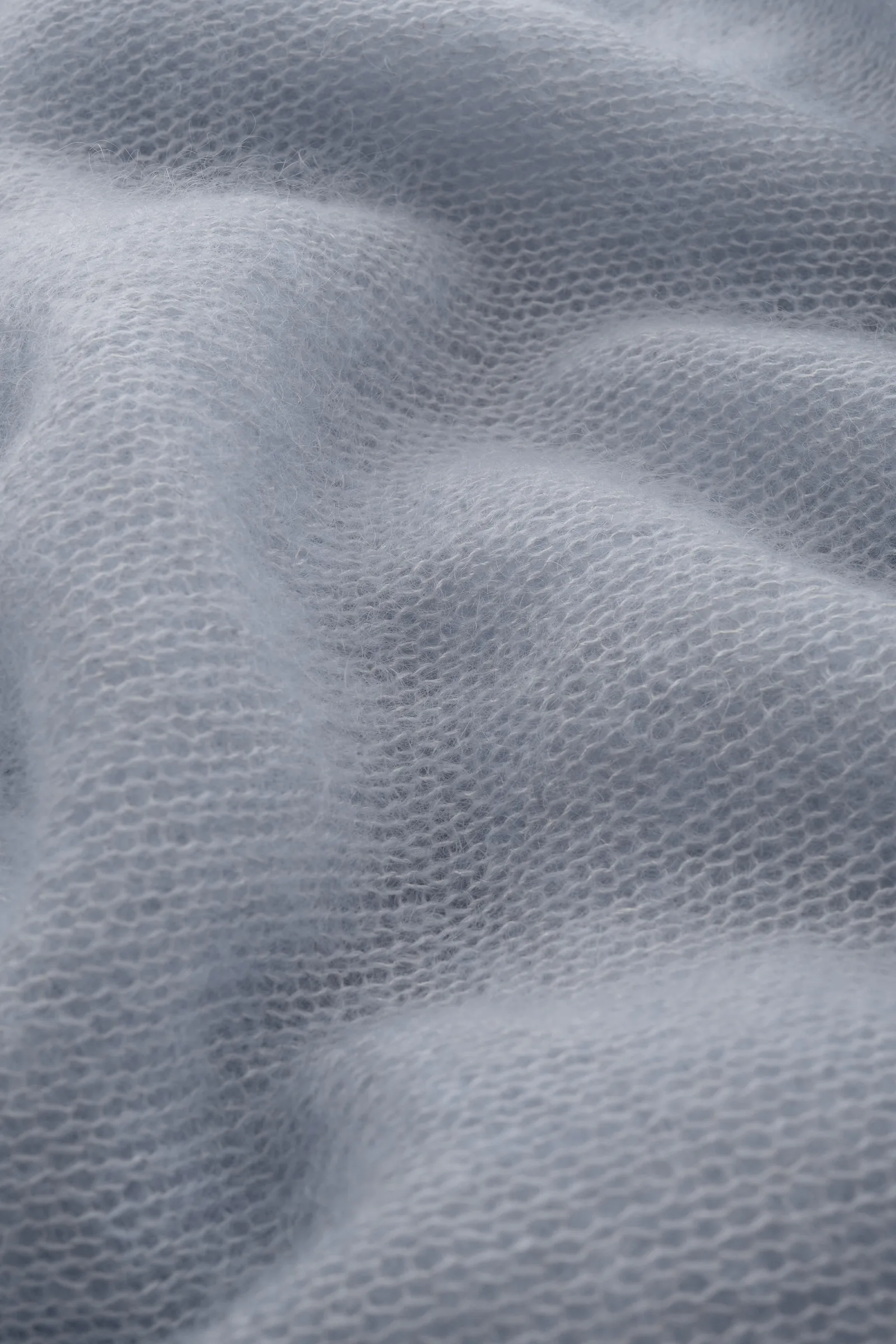PONCHO ŪKANA AUS SEIDE UND MOHAIR